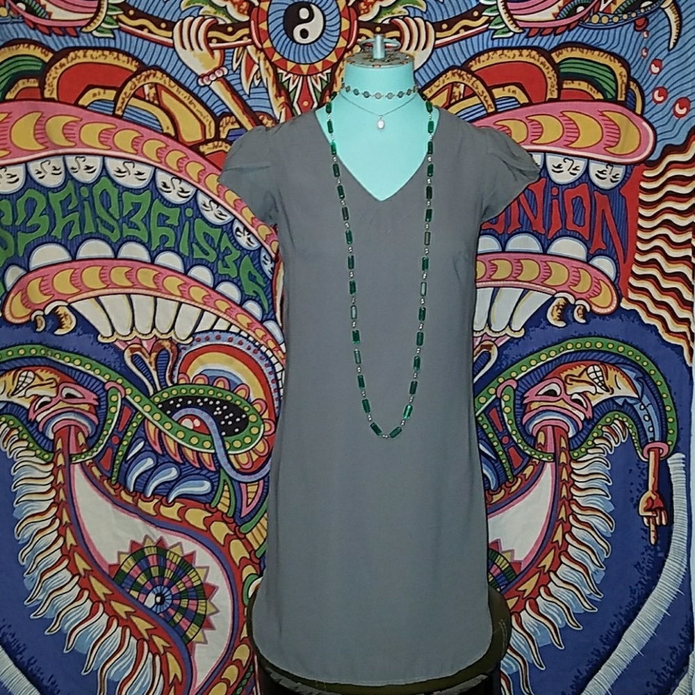Gray dress with ruffled sleeves.